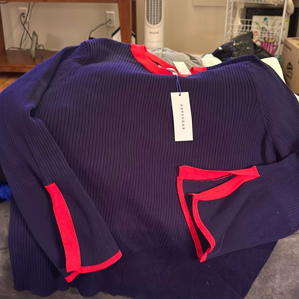 Navy blue and red long sleeve sweater New with tags. Bought at Kohl’s.